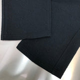 Flat lay presentation of Louis Vuitton luxury clothing with signature branding