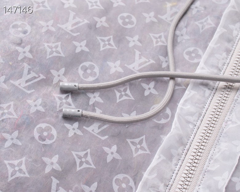 Flat lay presentation of Louis Vuitton luxury clothing with tailored silhouette