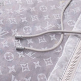 Flat lay presentation of Louis Vuitton luxury clothing with tailored silhouette
