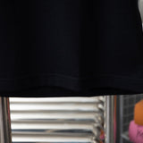 Flat lay presentation of Louis Vuitton cotton t-shirt with signature branding