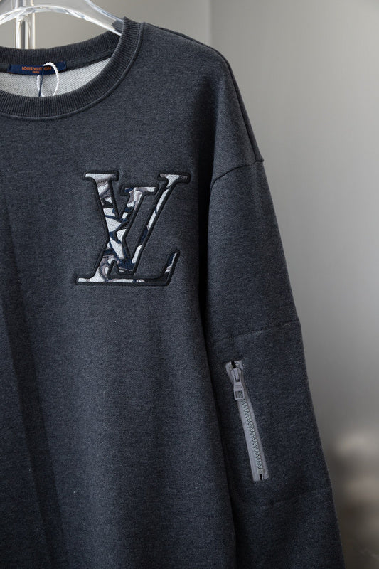 Flat lay presentation of Louis Vuitton luxury clothing with relaxed-fit cut
