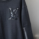 Flat lay presentation of Louis Vuitton luxury clothing with relaxed-fit cut
