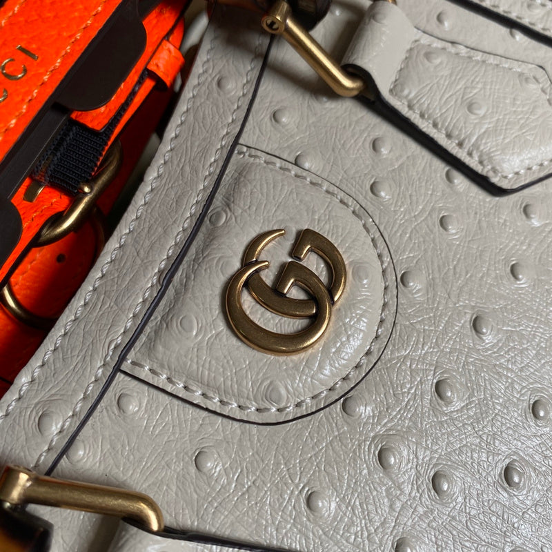 Styled lifestyle shot of classic signature women's handbag – women's luxury handbag