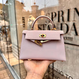 Side view of sculpted structured handbag