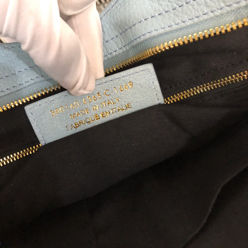 Side profile of statement chic women's handbag – women's statement bag