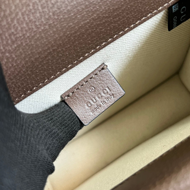Side profile of polished statement women's handbag – women's luxury handbag