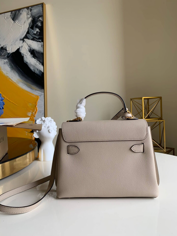 Styled lifestyle shot of modern sleek women's handbag – women's statement bag