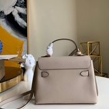 Styled lifestyle shot of modern sleek women's handbag – women's statement bag