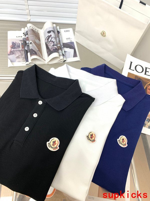 Close-up detail shot of Moncler luxury clothing with signature branding