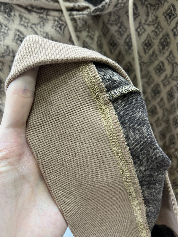 Side profile of Louis Vuitton luxury clothing with logo-detail design