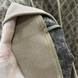 Side profile of Louis Vuitton luxury clothing with logo-detail design