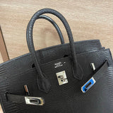 Side view of modernist structured handbag