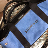 Styled lifestyle shot of premium classic women's handbag – women's statement bag