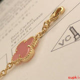 Lifestyle view of Van Cleef & Arpels unisex jewelry piece