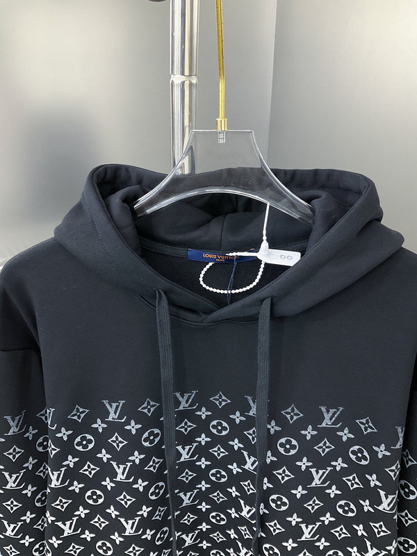 Close-up detail shot of Louis Vuitton luxury clothing with monogram-inspired silhouette