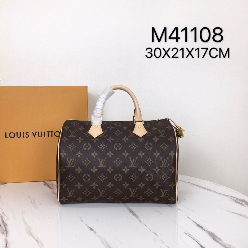 Front view of signature polished women's handbag – women's luxury handbag