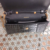 Side profile of structured modern women's handbag – women's luxury accessory