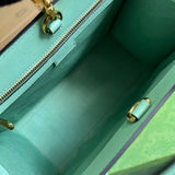 Side profile of statement polished women's handbag – women's statement bag
