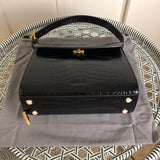 Side profile of structured refined women's handbag – women's luxury accessory