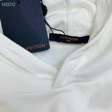 Close-up detail shot of Louis Vuitton luxury clothing with relaxed-fit cut