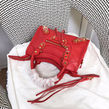 Styled lifestyle shot of classic structured women's handbag – women's statement bag