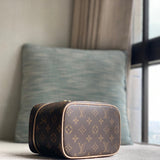  Sophisticated top-handle bag carried on shoulder
