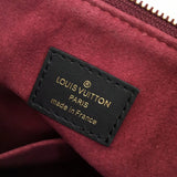 Side profile of statement modern women's handbag – women's luxury handbag