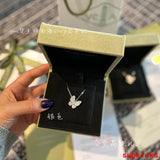 Lifestyle view of Van Cleef & Arpels unisex jewelry piece