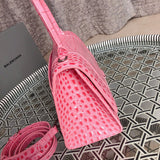 Side profile of statement polished women's handbag – women's statement bag
