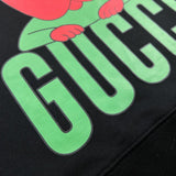 Front view of Gucci luxury clothing with signature branding