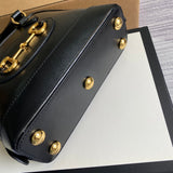 Styled lifestyle shot of classic refined women's handbag – women's luxury handbag