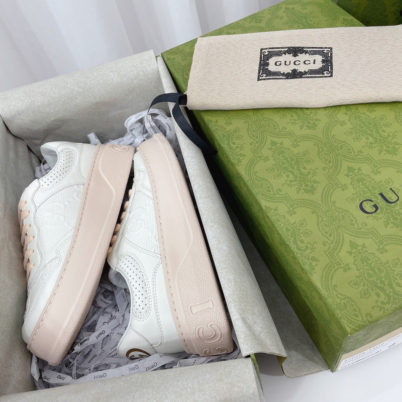 Side profile of Gucci fresh white-and-black sneakers sleek tonal finish