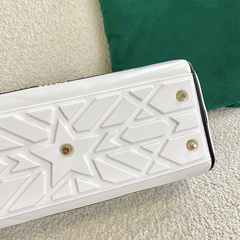 Styled lifestyle shot of modern polished women's handbag – women's luxury handbag