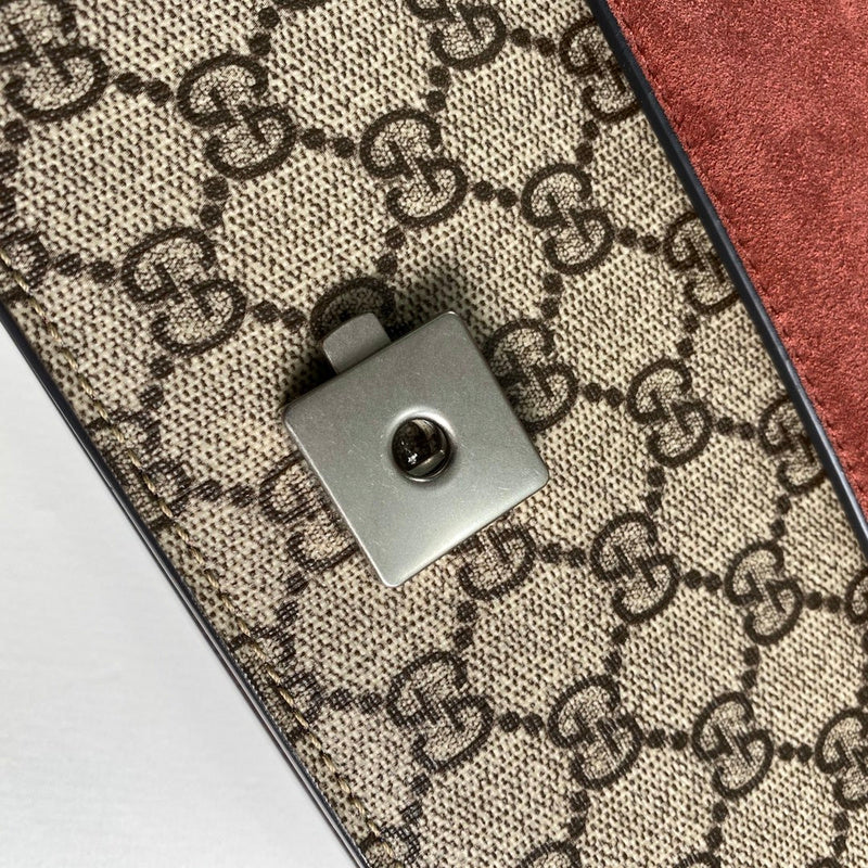 Close-up detail of signature polished women's handbag – women's statement bag