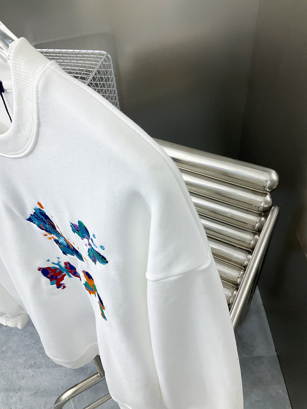 Full styled look of Louis Vuitton luxury clothing with label-forward styling