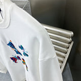Full styled look of Louis Vuitton luxury clothing with label-forward styling