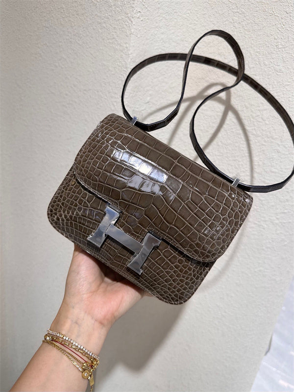  Understated structured bag carried on shoulder