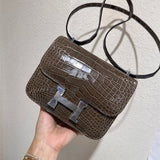  Understated structured bag carried on shoulder