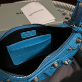 Side profile of elevated modern women's handbag – women's luxury accessory