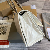Side view of sleek structured handbag
