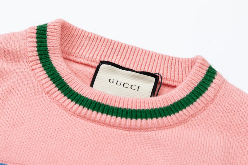 Close-up detail shot of Gucci luxury clothing with logo-detail design