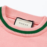 Close-up detail shot of Gucci luxury clothing with logo-detail design
