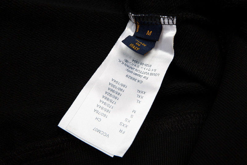 Back view of Louis Vuitton luxury clothing with signature branding