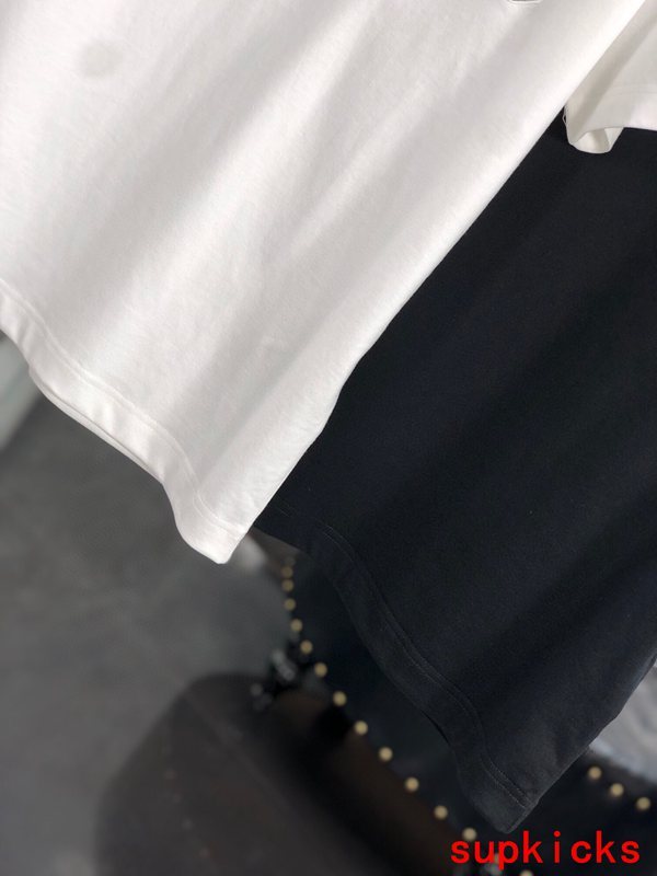 Flat lay presentation of Moncler luxury clothing with relaxed-fit cut