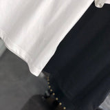 Flat lay presentation of Moncler luxury clothing with relaxed-fit cut