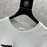 Close-up detail shot of Louis Vuitton luxury clothing with monogram-inspired silhouette