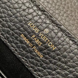 Side profile of polished structured women's handbag – women's luxury accessory