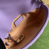 Side profile of structured elevated women's handbag – women's luxury accessory