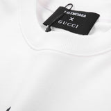 Close-up detail shot of Gucci luxury clothing with signature branding