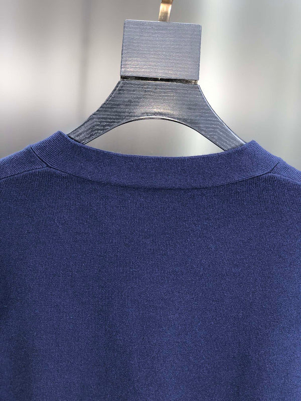 Side profile of Louis Vuitton luxury clothing with signature branding